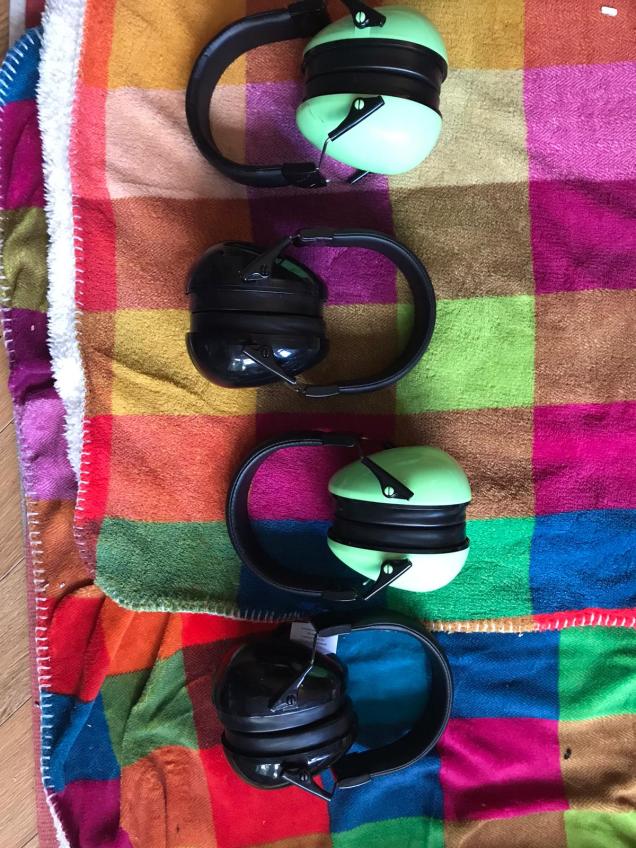 Line of ear defenders laid out on a blanket