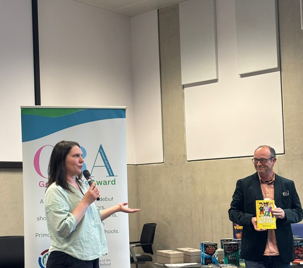 Niamh speaking at the event with a microphone